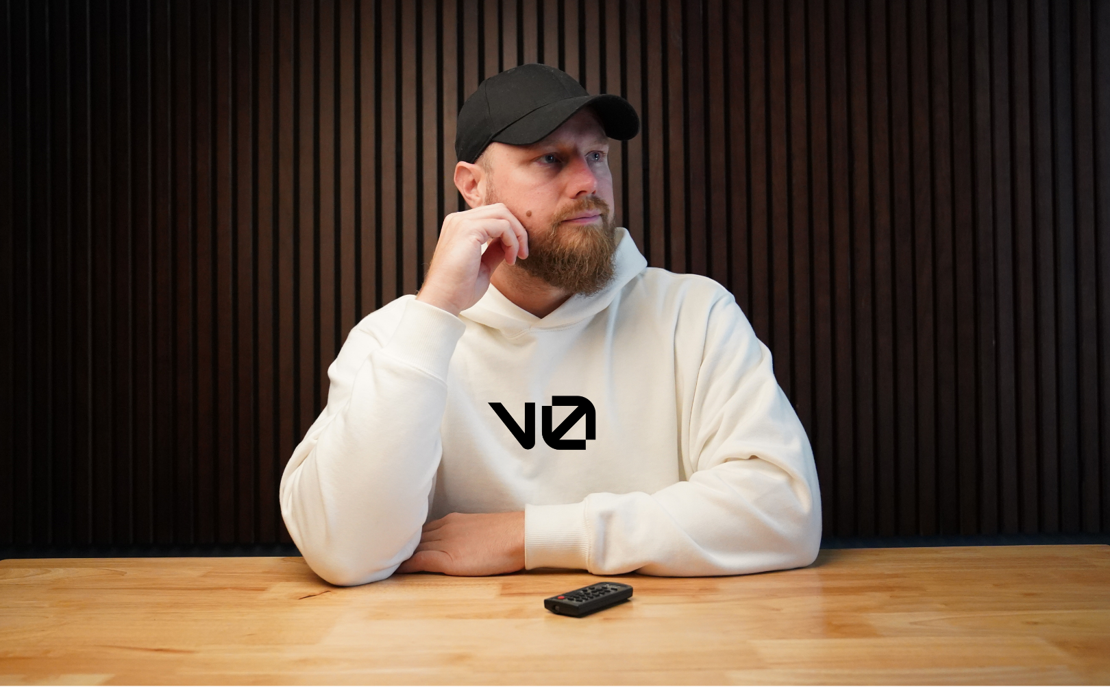 WatchmeGPT host in v0 hoodie at desk